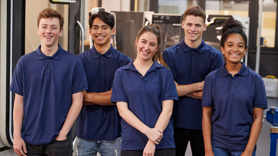 Portrait Of Engineering Apprentices In Factory